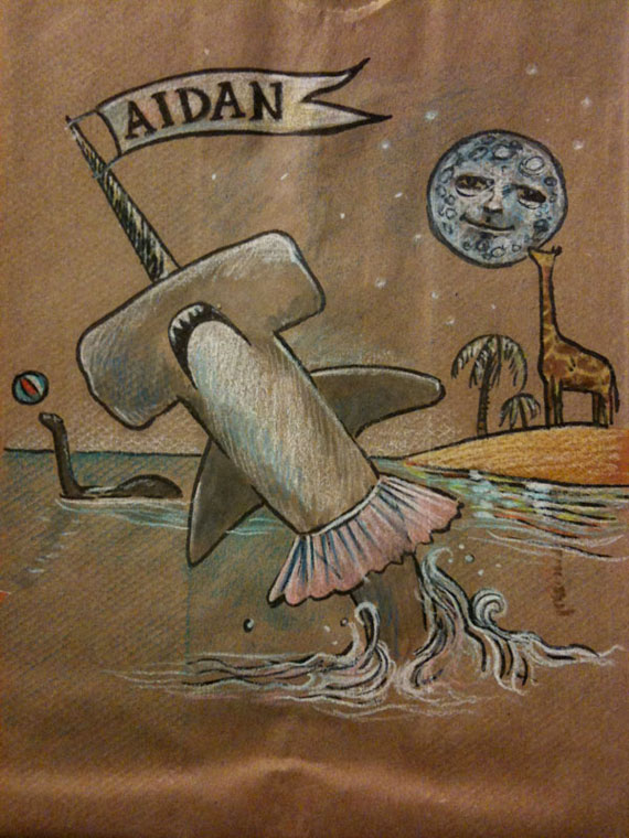 Illustration of lots of stuff, including a hammerhead shark in a tutu, on a lunchbag