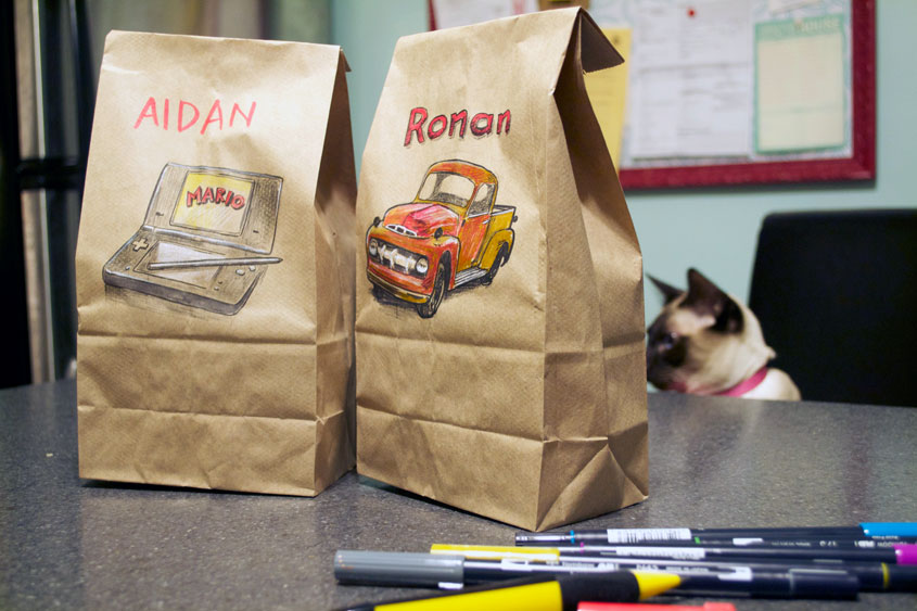 Illustrated lunchbags on counter